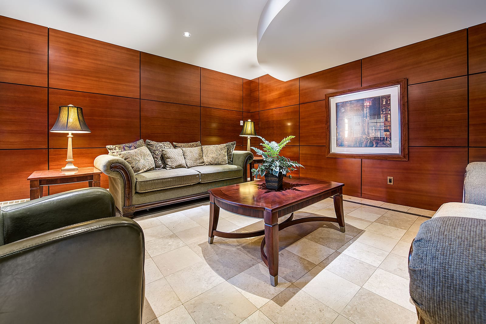 Wood-panelled lobby lounge with sofas and armchairs