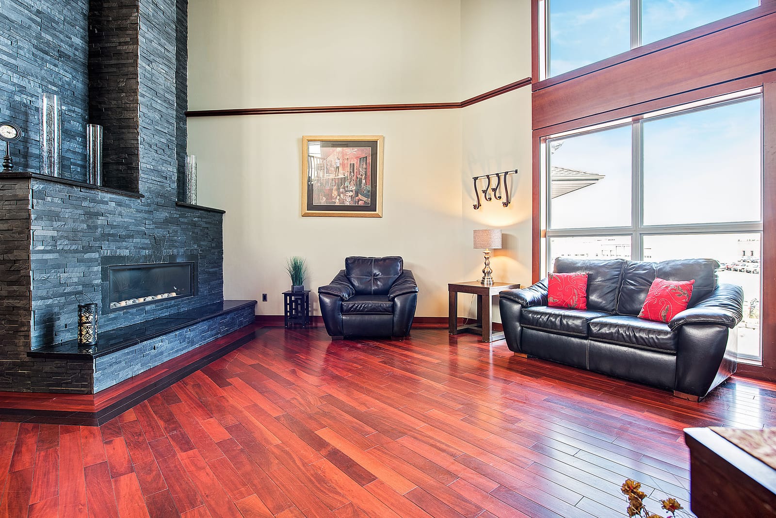 Party room with a slate fireplace wall and tall windows